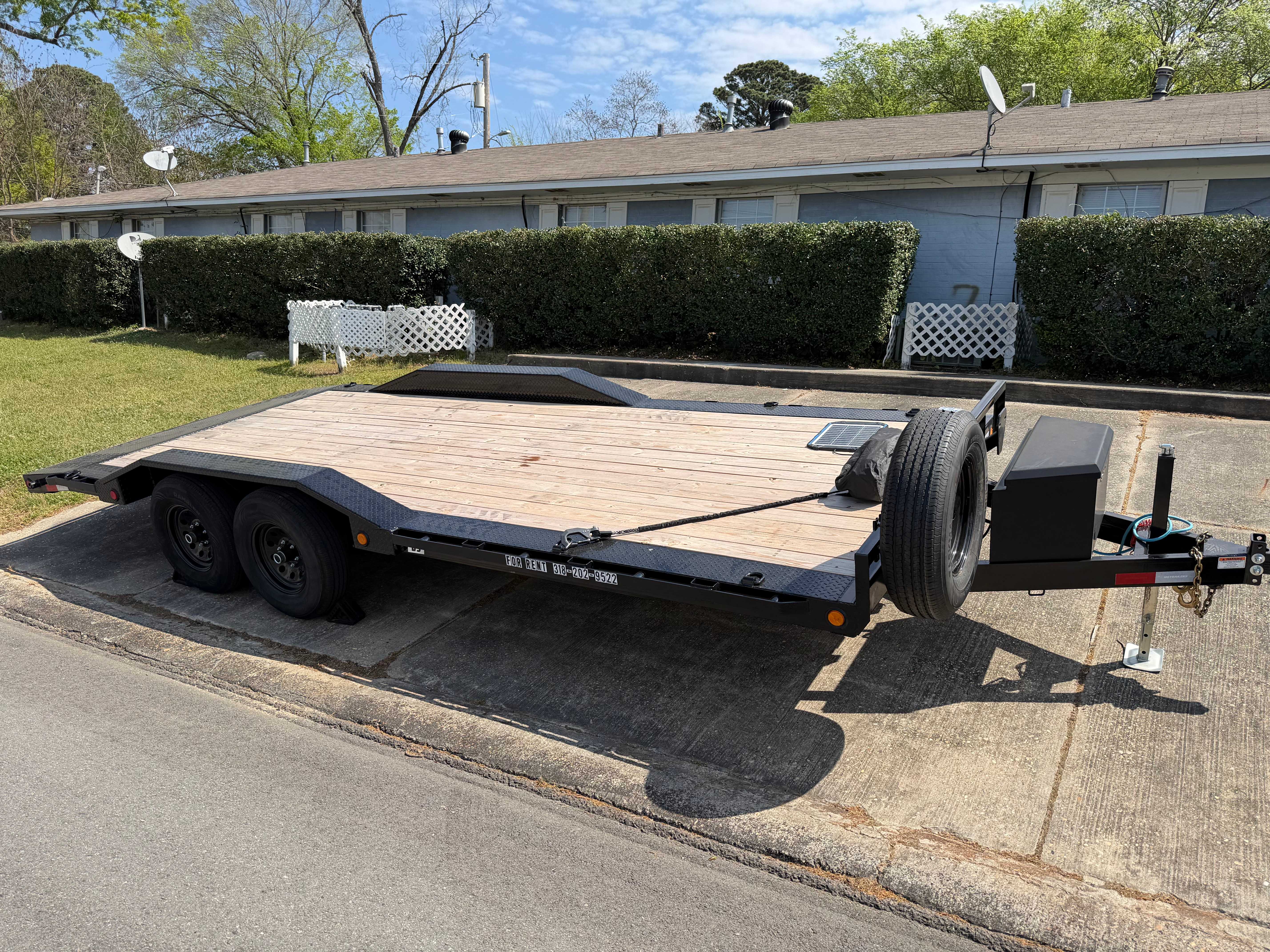 Professional 20ft PJ car hauler trailer rental available in Ruston, Louisiana - featuring tilt deck and electric winch